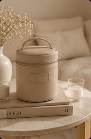 Woman opening La Petite case on bed